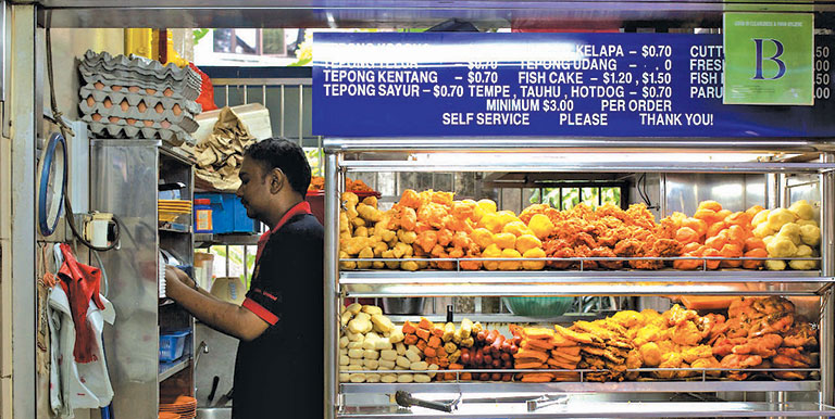 A typical stall within a hawker center in Singapore. Photo credit: Matthew Hine, CC by-NC-2.0