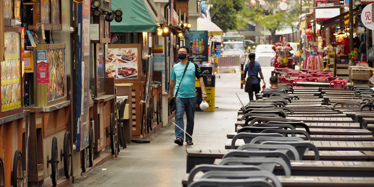 Shops and restaurants are open for business, but customers are few and far between in this once-bustling district in Singapore. Photo credit: ADB.