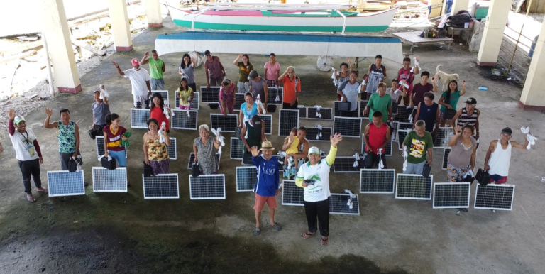 Residents brought their portable solar kits with them to charge lights and mobile phones at the evacuation centers. Photo credite: Light of Hope PH