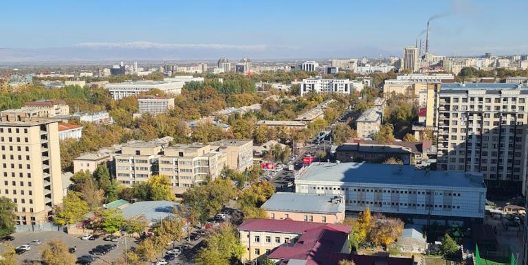 A mixed industrial and green landscape signals the need to scale ESG practices in response to climate risks. Photo credit:Roman Vakulchuk.