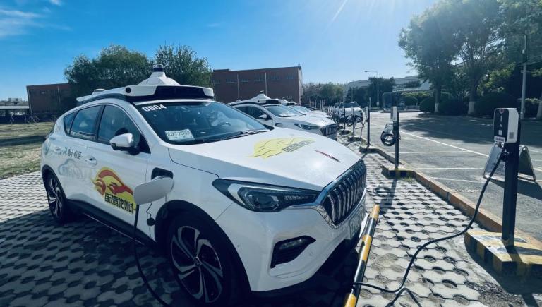 A driverless electric robotaxi (Apollo Go) navigating Beijing streets showcases the future of low-emission transport. Photo credit: Khalil Raza. 